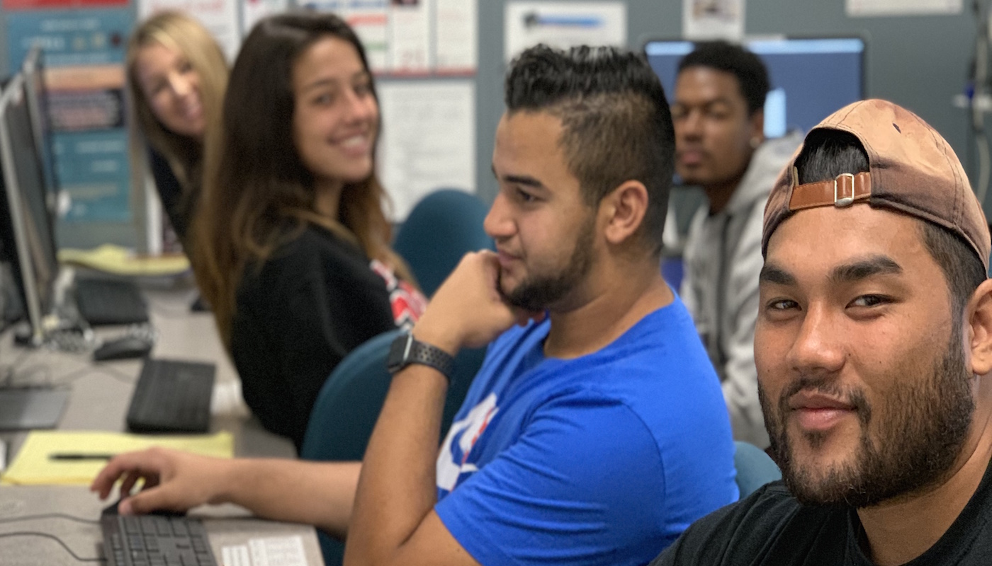 5 students doing assignments at career center computers